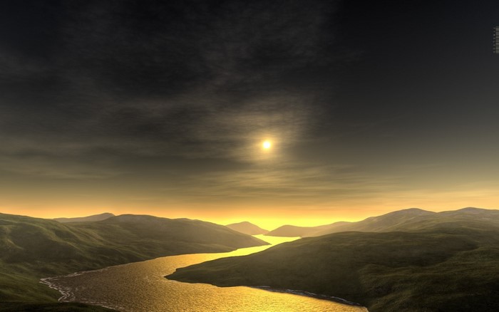 Sun setting over a river valley with rolling hills
