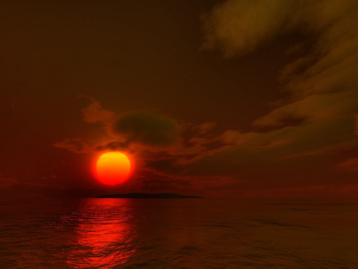 Sunset over the ocean with island and clouds