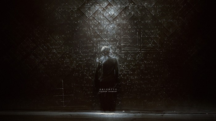 Man in front of blackboard with equations