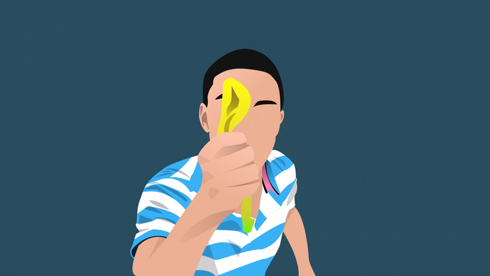 Person holding a yellow object in front of face