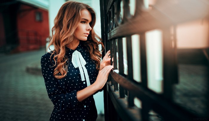 Woman in polka dot dress by Ivan Gorokhov