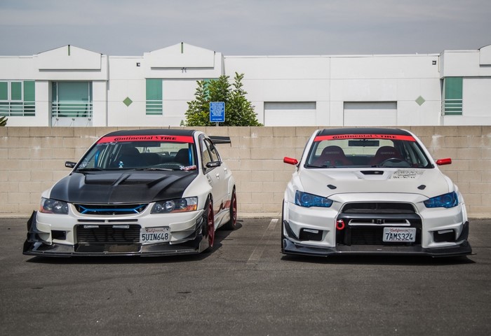 Two Mitsubishi Lancer Evolution cars parked