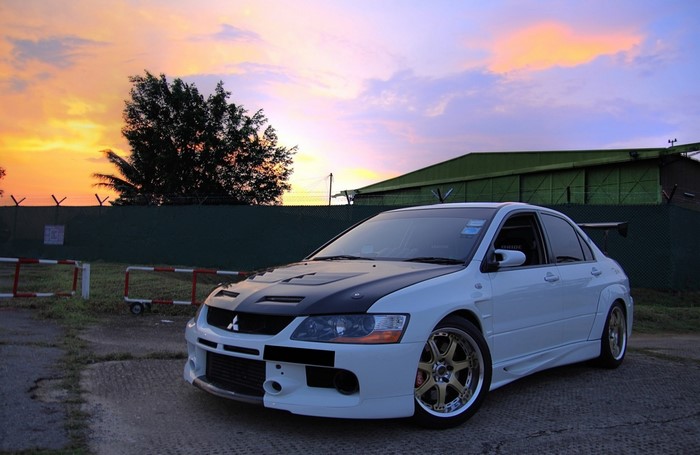 White Mitsubishi Lancer Evolution with Black Hood