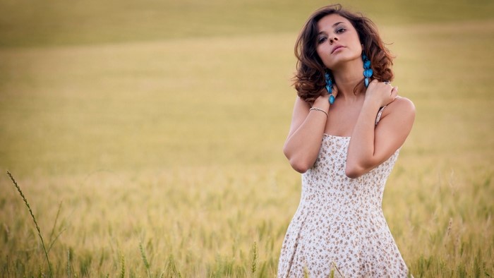 Woman in a floral dress in a field