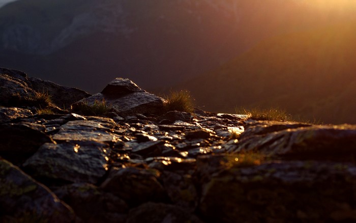 Rocky mountain peak at sunset with golden light