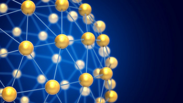 Abstract 3D network of golden spheres on blue background