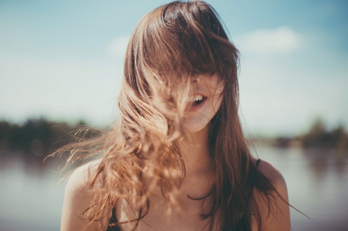 Woman with hair blowing in her face