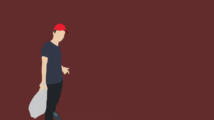 Man in red cap holding a bag