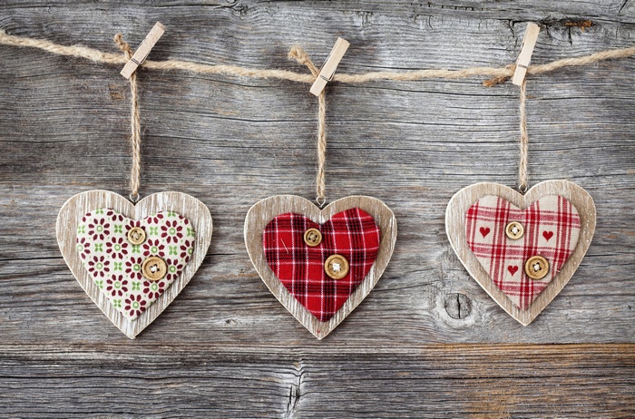 Three decorative hearts hanging on a clothesline