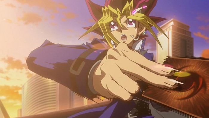 Yugi Muto from Yu-Gi-Oh! holding a card