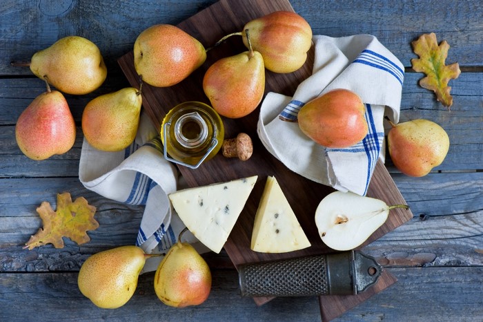 Still life of pears, cheese, and olive oil