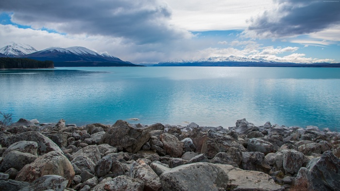 Lake Pukaki with Snow-Capped Mountains and Stones