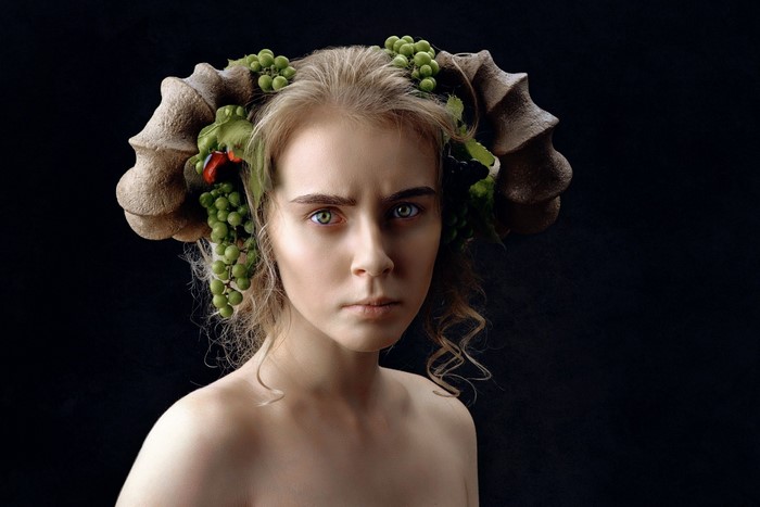 Woman with horns and grapes