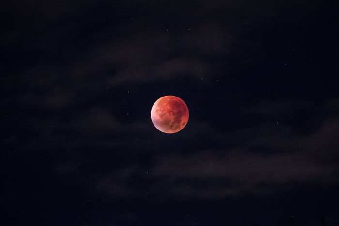 Red Moon in a Starry Night Sky