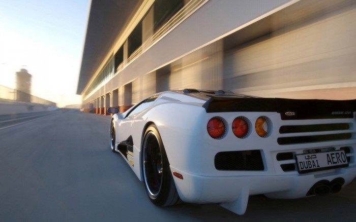 White SSC Ultimate Aero on a race track