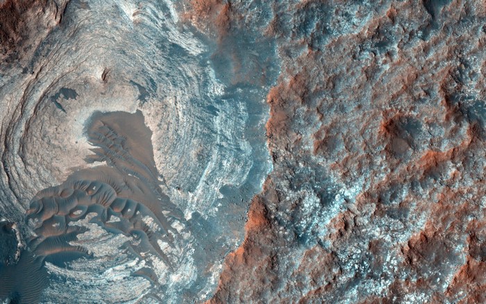 NASA Mars terrain with layered rock formations and sand dunes