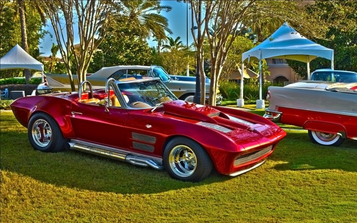 Red Chevrolet Corvette convertible with custom hood scoop