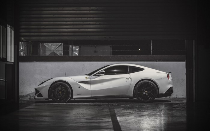 White Ferrari F12berlinetta parked in a garage