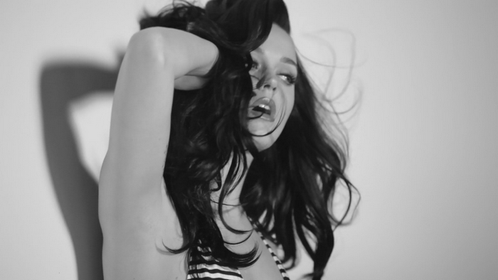 Monochrome portrait of a woman with long dark hair