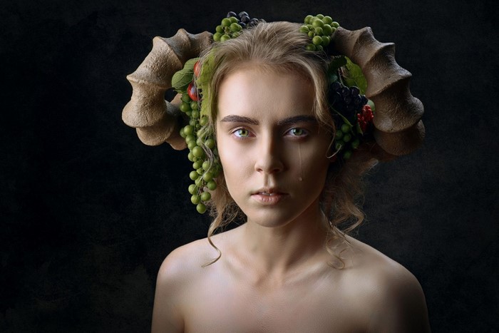 Woman with ram horns and fruit crown