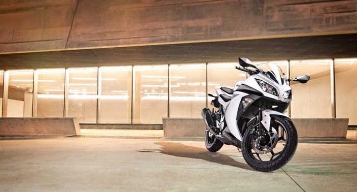 White Kawasaki Ninja 300 motorcycle parked outdoors