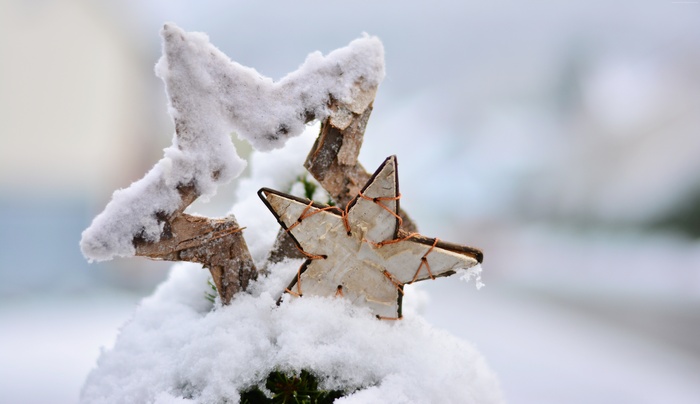 Christmas star decoration covered in snow