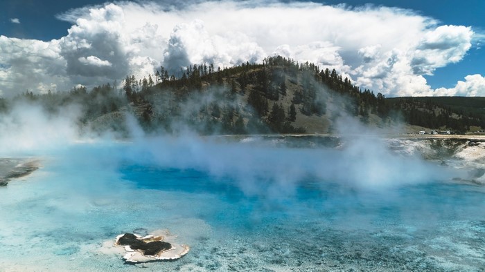 Steam rising from a blue hot spring in Yellowstone National Park