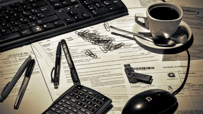 Monochrome Office Desk with Computer and Coffee
