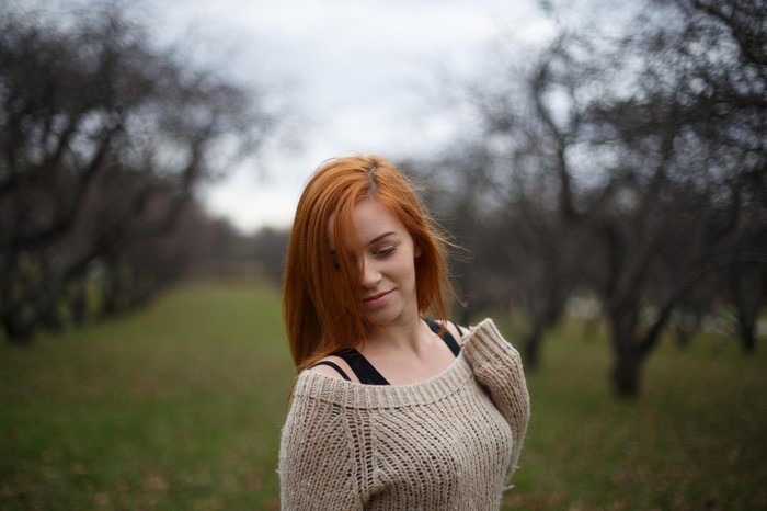 Redhead Woman in Cozy Sweater Outdoors in Autumn