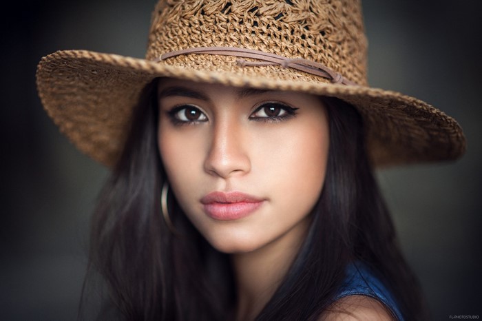 Portrait of Woman Wearing Straw Hat