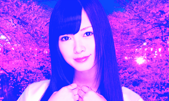 Japanese woman with long dark hair and pink flowers