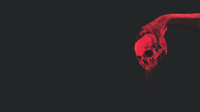 Red hand holding a skull