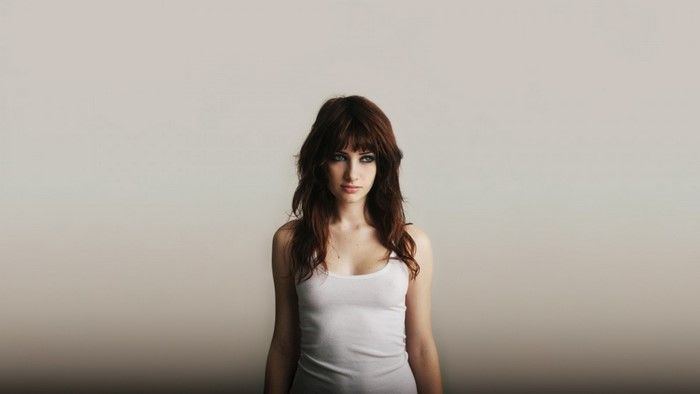 Portrait of a Woman with Long Brown Hair in White Tank Top