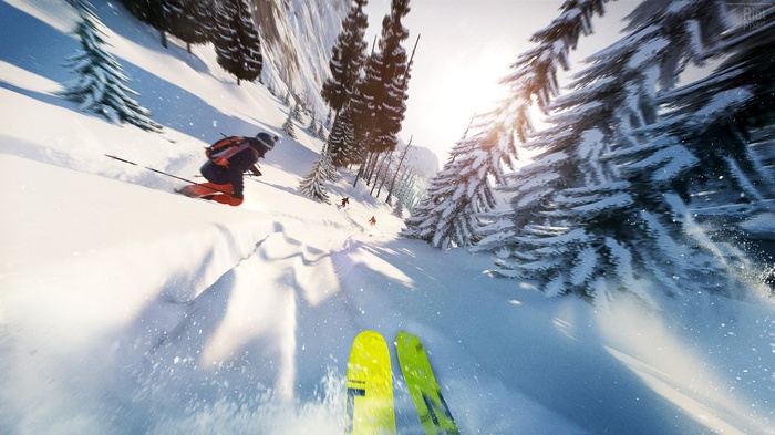 Skiers descending a snowy mountain slope