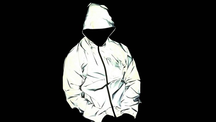 Man in reflective jacket with hood