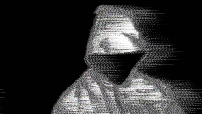 Person in a hoodie with glitch effect