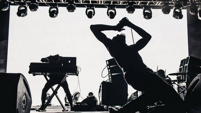 Death Grips performing live on stage