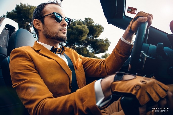 Man in suit driving a BMW Z4