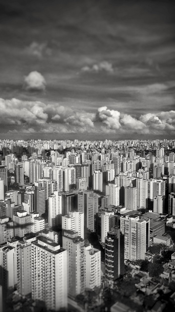 Monochrome cityscape of Sao Paulo, Brazil with skyscrapers and clouds