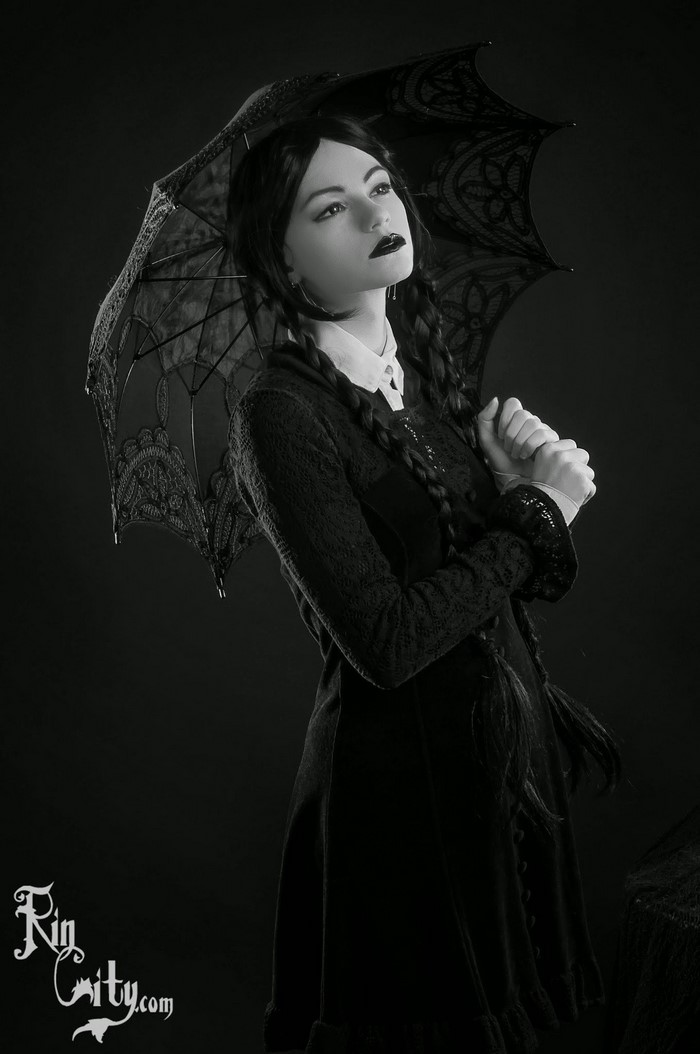 Wednesday Addams cosplay with black umbrella