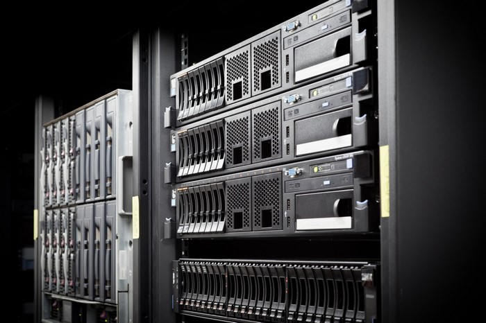 Server rack with multiple hard drive bays and computer hardware