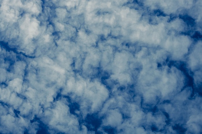 Blue sky with white cumulus clouds
