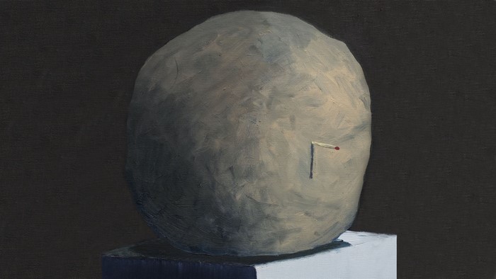 Sphere with a lit match on a pedestal