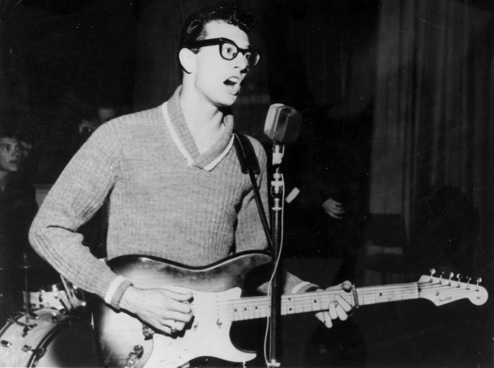 Buddy Holly singing and playing guitar