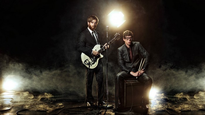 The Black Keys perform on a smoky stage