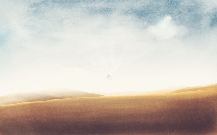 Desert landscape with rolling hills and hazy sky