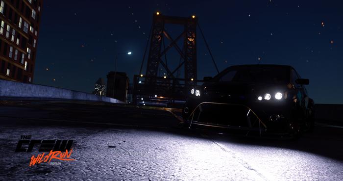 The Crew Wild Run car at night on a bridge