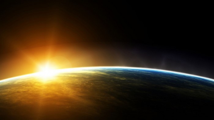 Sunrise over planet Earth from space