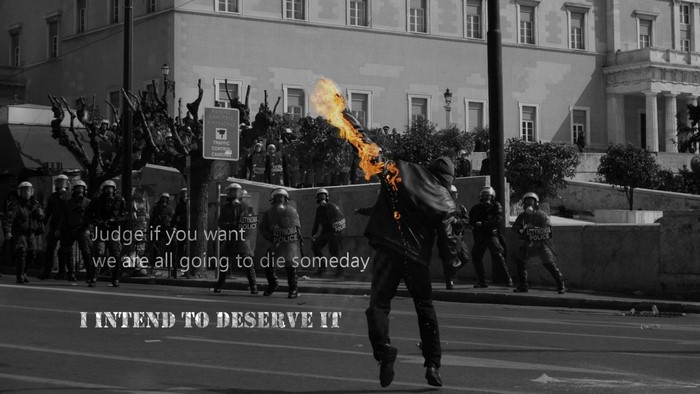Protester engulfed in flames facing police