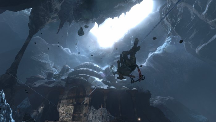 Lara Croft from Rise of the Tomb Raider rappels in a cave